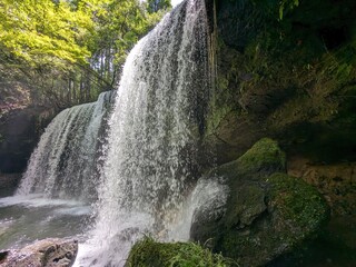 Poster - The Nabegataki Falls, where travelers can access the large cavern behind the falls