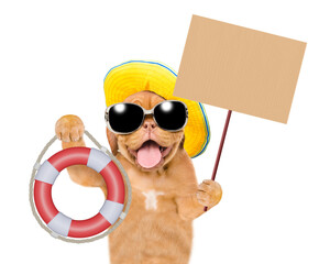 Poster - Happy mastiff puppy wearing mirrored sunglasses and summer hat screaming into a megaphone and showing lifebuoy. Isolated on white background