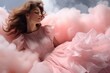 Romantic brunette in a pink dress on a pink cloud. Concept of romanticism and dreaming.