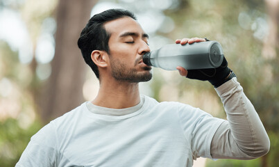 Sticker - Sports, man and drinking water in park for exercise break, energy and workout rest. Thirsty athlete, asian runner and bottle for hydration, nutrition and healthy recovery of fitness in nature outdoor