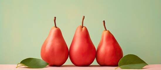 Poster - Red pears with leaves on a isolated pastel background Copy space