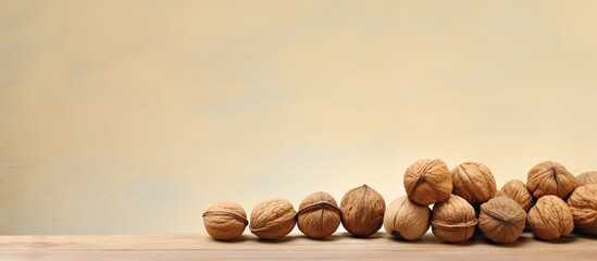 Poster - Various walnuts including empty shells are set against a isolated pastel background Copy space