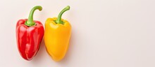 Red And Yellow Bell Peppers On A Isolated Pastel Background Copy Space