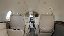 Tail Section Of Private Jet Revealing View On Luxurious Vip Salon With Bright Leather Seats And Portholes. Interior Of Business Plane With Best Conditions For Comfy Flight