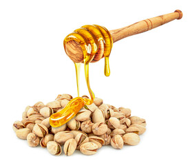 Wall Mural - honey dripping on pistachio nuts isolated on white background