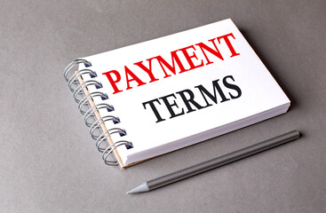 Poster - PAYMENT TERMS word on notebook on grey background
