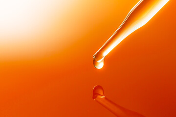Wall Mural - yellow science test tube,dropping yellow chemical liquid or essential oil to test tube on white back