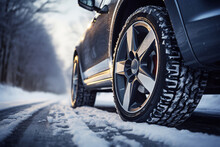 Close-up Image Of Winter Car Tire On The Snowy Road. Drive Safe Concept.