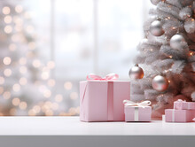 Silver And Pink Christmas Tree And Presents On Empty Table With Blurred Bokeh Lights