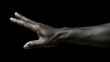 © AlexCaelus - Hand gesture isolated on black background