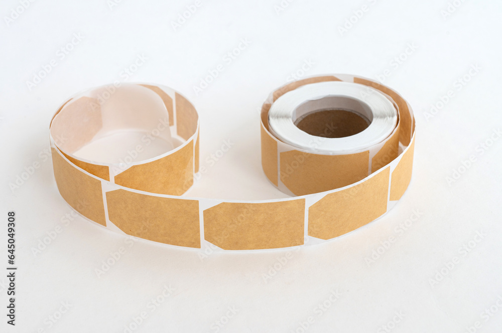 Blank sticker mockup for price tag. Blank tags in a roll. White kraft ...