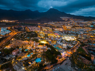Wall Mural - illuminated night city light view, ocean shore, Tenerife, Canary island aerial