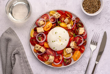 Wall Mural - Food photography of salad, baked tomato; cheese; burrata; mozzarella; white wine, garlic; crouton; thyme; toast; vegetable