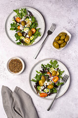 Wall Mural - Food photography of salad; cheese manouri, feta; vegetable; tomato; cucumber; onion; lettuce; sauce; pepper; olive; seasoning