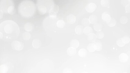 White abstract video background with shimmering bokeh light flashes and rotating particles. Abstract motion loop background.