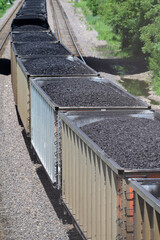 Wall Mural - Hopper cars loaded with coal make up a unit train passing through northeastern Illinois. The train originated at a mine in Wyoming destined for a Wisconsin utility company.