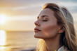 © larrui - Serenity and Inner Peace: A Blonde Woman's Meditation by the Ocean at Dusk, ai generative