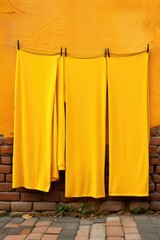 Poster - Yellow cloth hanging on a clothesline at baground of yellow wall, AI