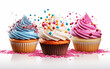 Cupcakes with colorful frosting and sprinkles on white background