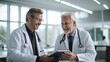 © Oulaphone - Two doctors having discussion about patient diagnosis in hospital.