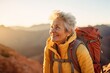 © CojanAI - Smiling portrait of a happy senior woman hiker hiking in the forest and mountains