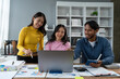 © Phimwilai - Confident group of asian businessmen working together in office technology creative team brainstorming meeting calculate income graph document internet partner teamwork concept of coworkers.