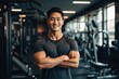 © NikoG - Smiling portrait of a happy young male asian american fitness instructor in an indoor gym