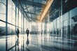 © Pacharee - Business people walking in glass office building.