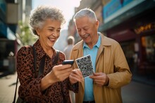 Happy Senior Couple Using Mobile Phone While Walking In The City. They Are Smiling And Looking At The QR Code