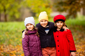 Wall Mural - Group of friends play in autumn park