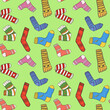 Seamless pattern of funny socks on a green background