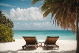 Fototapeta  - Beach chairs and umbrella on a tropical beach.