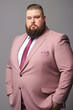 © ЮРИЙ ПОЗДНИКОВ - A successful overweight businessman dressed in a pink-colored suit. High quality photo