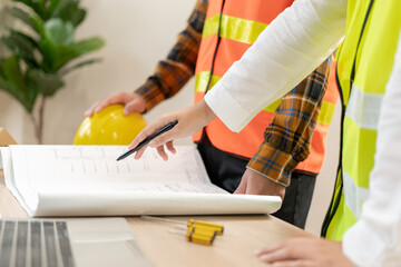 Wall Mural - Engineers team and owner discuss check and review the blueprint of construction. Contractor inspection drawing before start project civil. project planning, consulting, architecture.