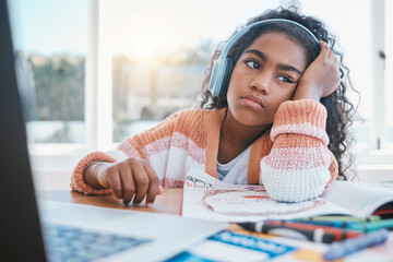 Child, headphones and girl tired of home school, e learning and future online education. Thinking, bored and kid with ADHD, autism and sad at laptop while drawing and listening to audio at table