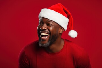 Poster - dark-skinned man Santa Claus on red background.