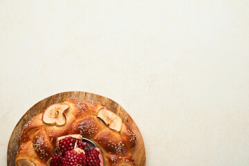 Wall Mural - Jewish Holidays - Rosh Hashanah or Rosh Hashana. Pomegranate, apples, honey and round challah on rustic grey table background. Jewish Autumn celebration. Shana Tova. Yom kippur concept. Top view.