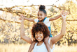 © Anela/peopleimages.com - Airplane, portrait and mother with girl child in a park happy, freedom and adventure in nature together. Flying, piggyback and kid with mom in a forest for games, travel or explore with care and love