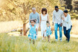 © Anela/peopleimages.com - Park, walking and happy family generations for bonding, having fun and talking together. Love, smile and children with parents and grandparents in nature in an outdoor green garden on weekend trip.