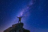 Fototapeta Las - Man looking at the night sky