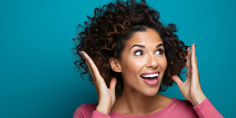 a young woman pointing on a plain blue background, fashio