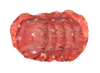 Slices of Bresaola della Valtellina, bottom sirloin cut, on white background. It is a traditional air dried salted beef cold meat from Lombardy, in Italy.