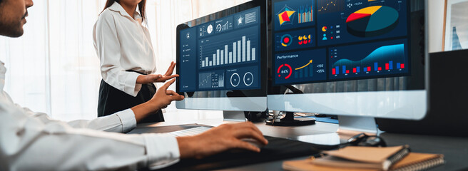 Poster - analyst working on data analysis or bi dashboard on computer monitor. business team analyzing financ