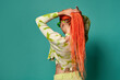 © ADDICTIVE STOCK - Trendy woman with Afro braids tying ponytail