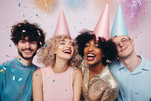 Candid Party Photo Of Friends On A Pastel Pink Background With Confetti