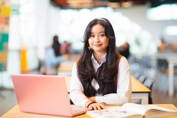 Asian girl in school. Student in classroom.