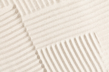 Sand pattern as background. Zen pattern in white sand. Beach sand texture in summer sun.