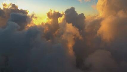 flying in the clouds at sunset