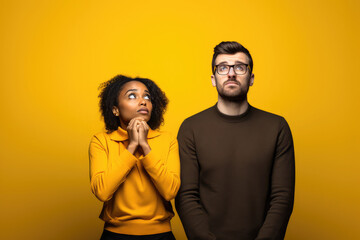 Wall Mural - couple standing together on yellow background