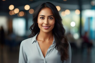 Wall Mural - Indian lady in front of blurred background.